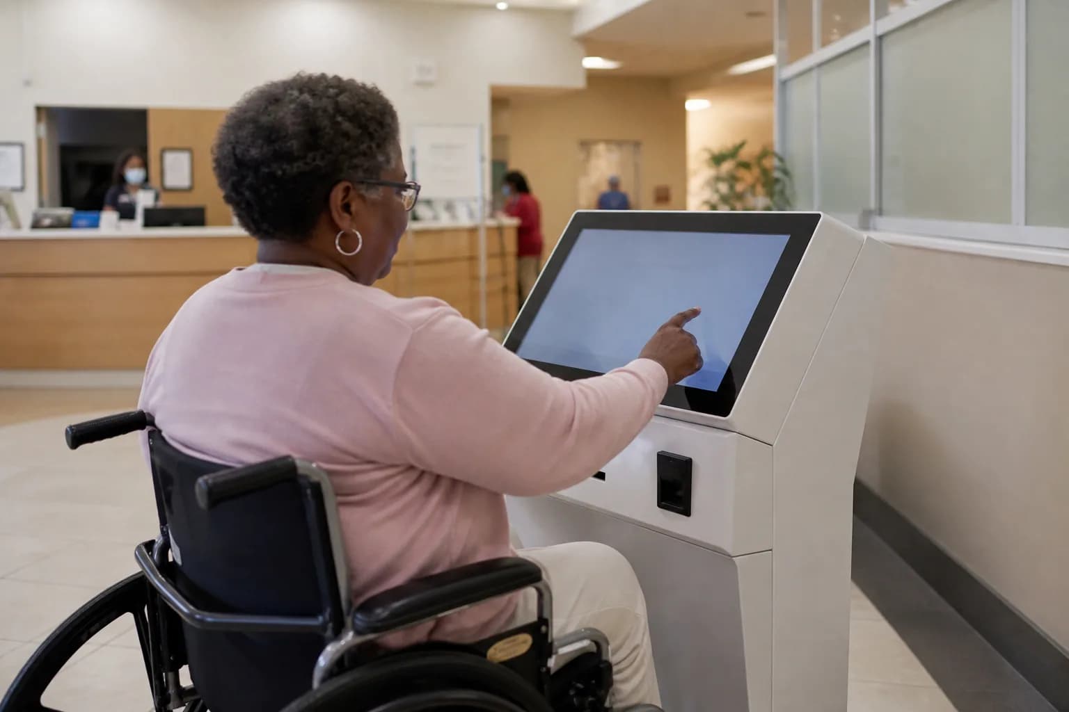 Hospital front desk registration counter with a queue of waiting patients