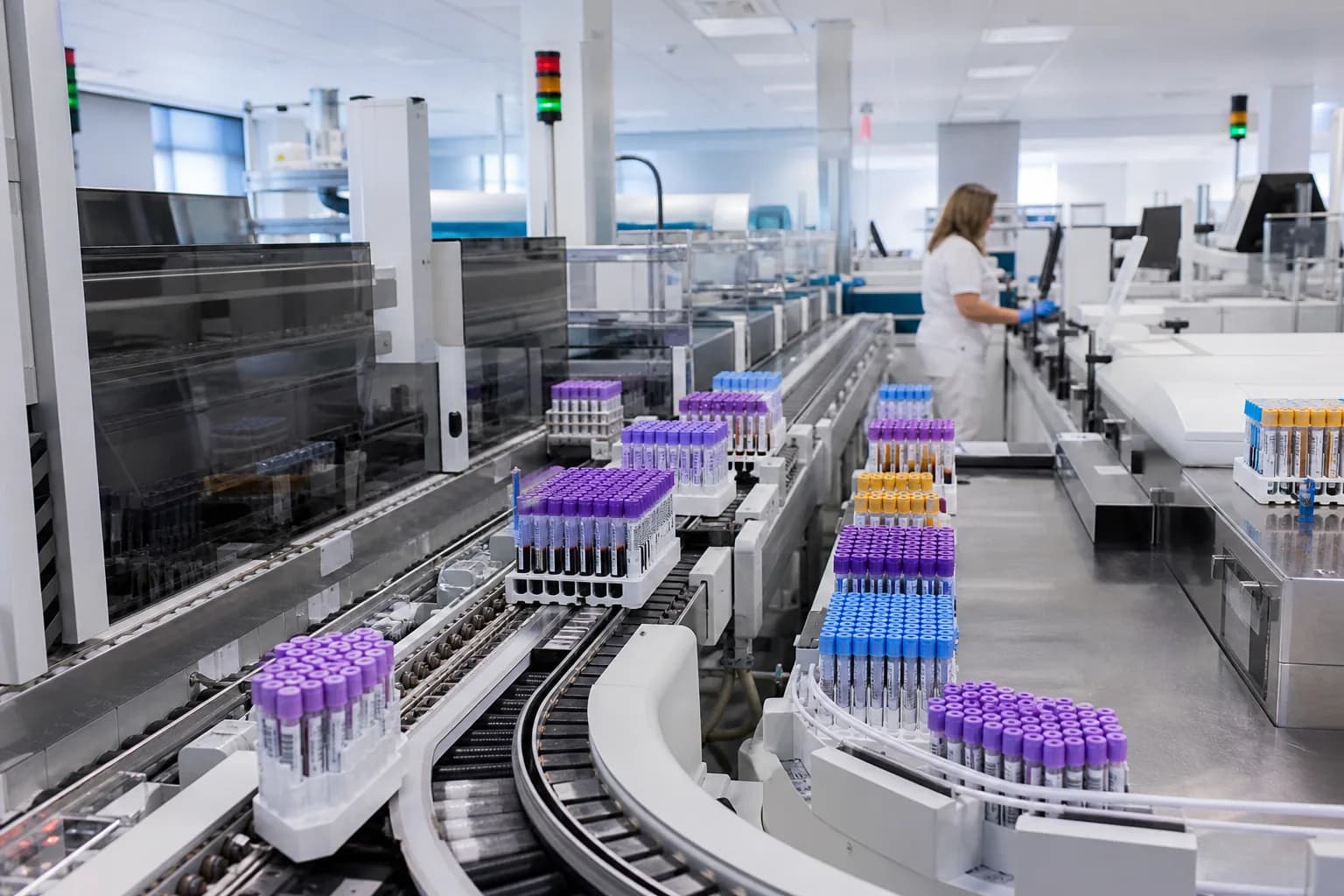 Medical technologist reviewing internal quality control results before releasing a batch of patient reports