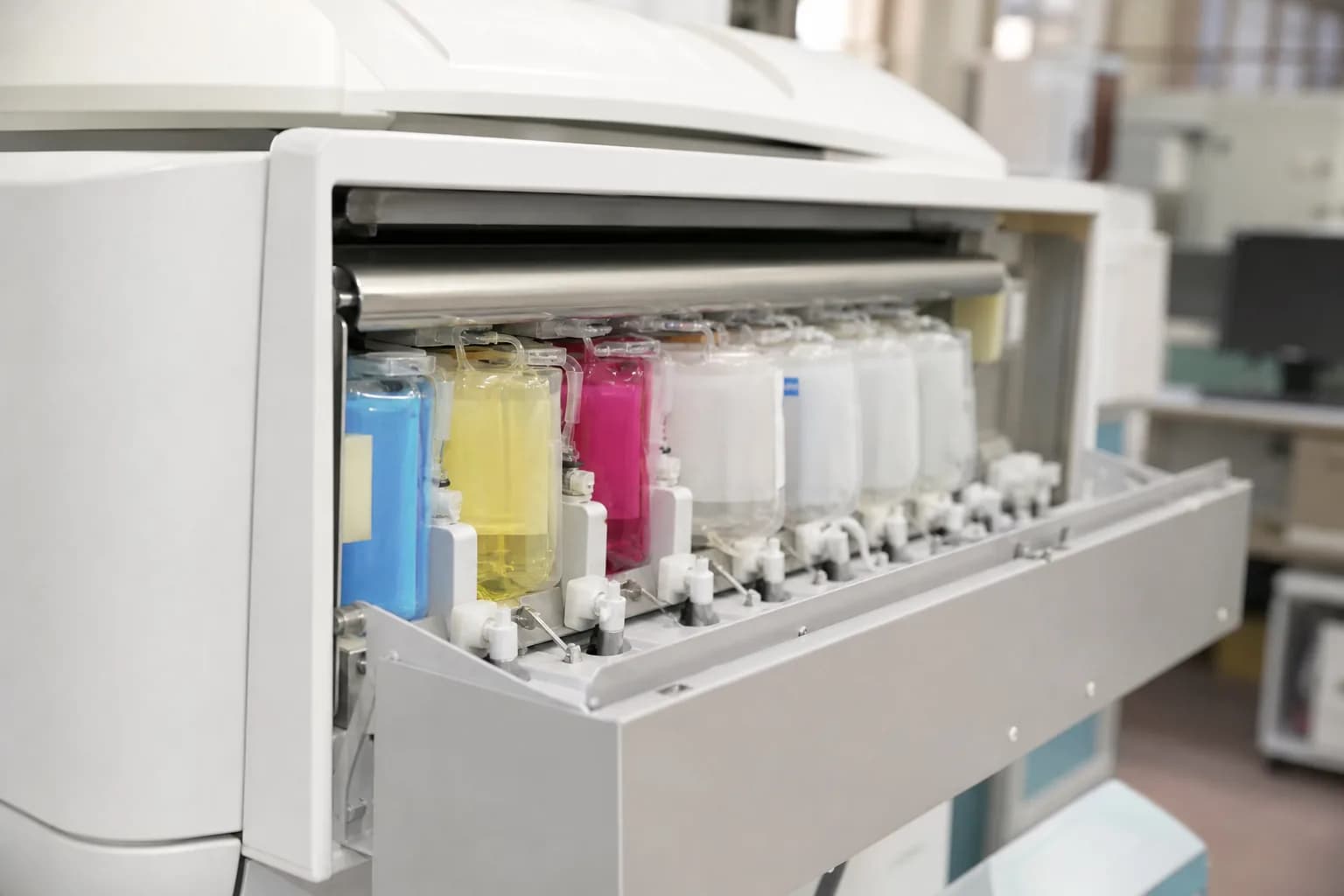 Phlebotomist placing collected samples into a temperature-controlled transport box at a patient's home